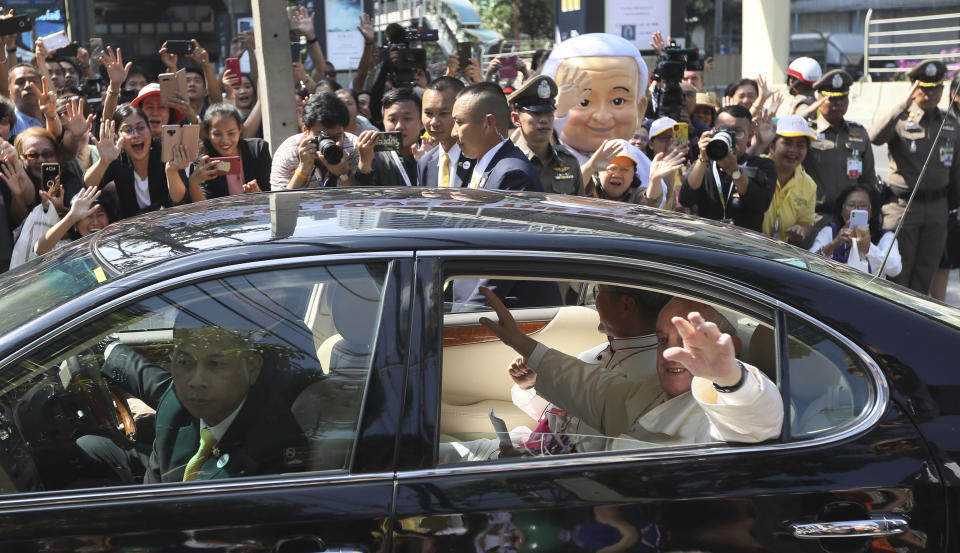 Pope Francis waves as he arrives at Apostolic Nunciature Embassy of the Holy See in Bangkok, Thailand, Wednesday, Nov. 20, 2019. Pope Francis is in Thailand for a three-day visit to encourage members of a minority Catholic community in a Buddhist nation and highlight his admiration for their missionary ancestors who brought the faith centuries ago and endured persecution. (AP Photo/Manish Swarup)