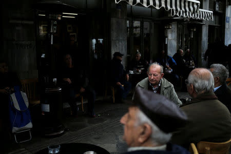 People sit at a cafe in central Athens, Greece, February 21. 2017. REUTERS/Alkis Konstantinidis