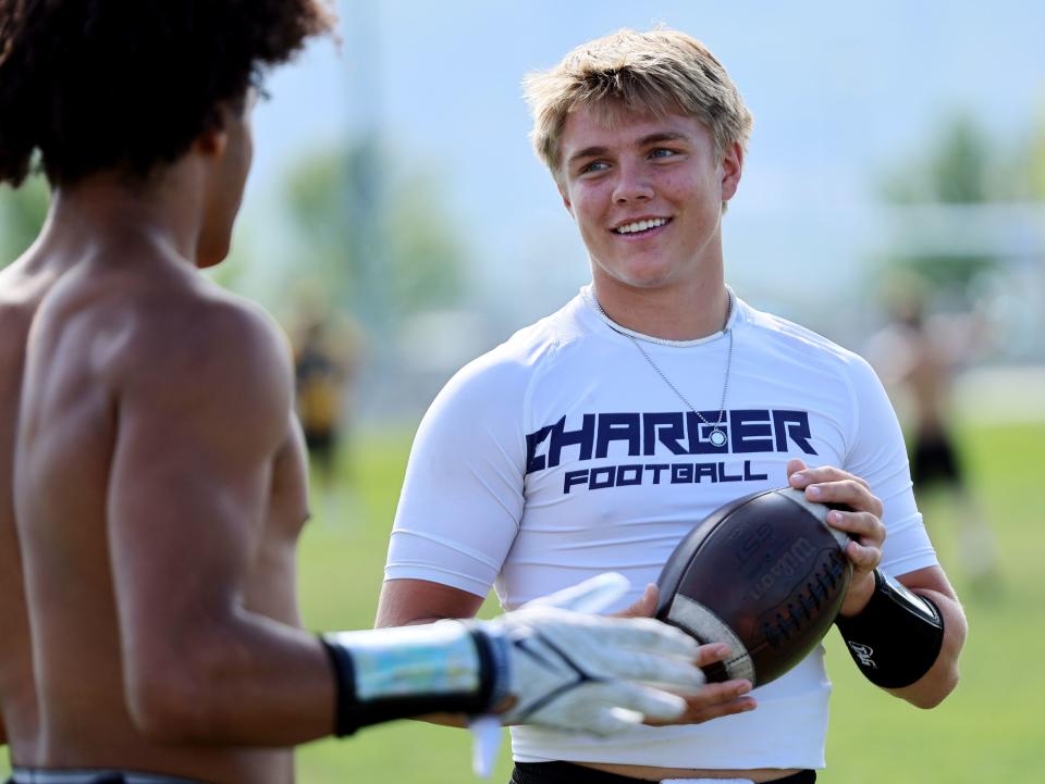Isaac Wilson talks with teammates during a seven-on-seven tourney in Layton on Friday, June 9, 2023. | Scott G Winterton, Deseret News