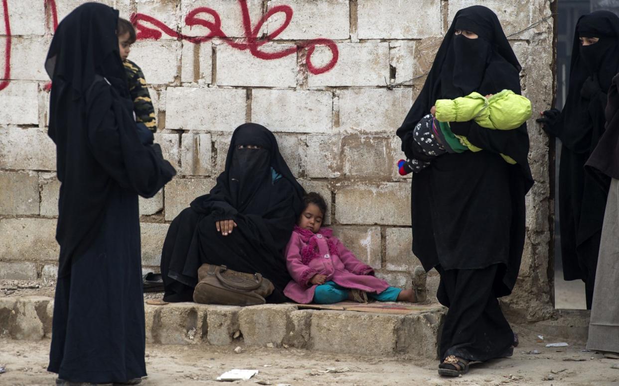 Women with their children among the 35,000 who have flocked to al-Hol camp in northeast Syria - AFP