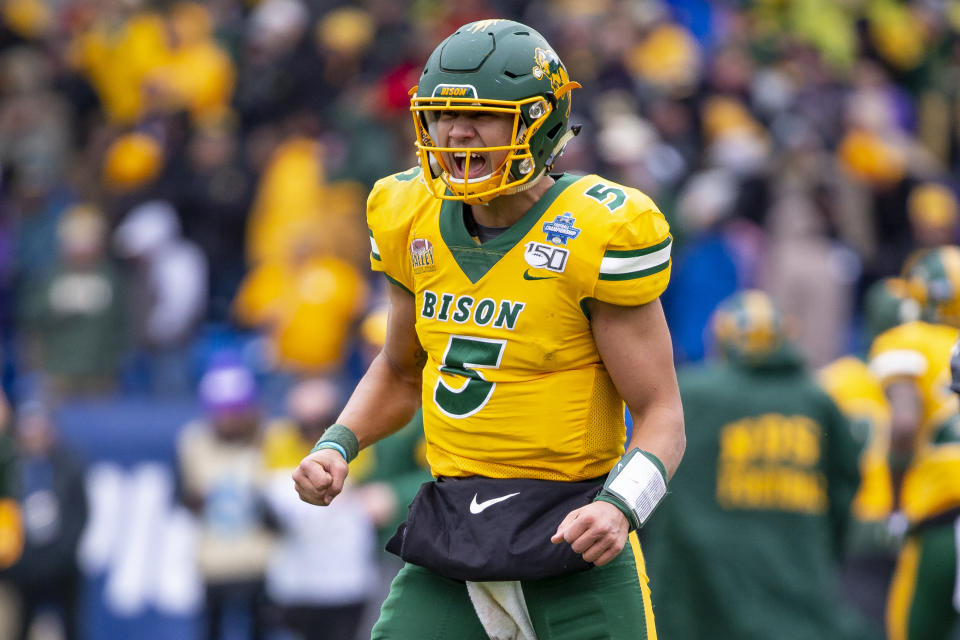 Trey Lance yells in celebration during a game.