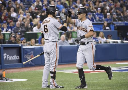 Apr 23, 2019; Toronto, Ontario, CAN; San Francisco Giants second baseman Joe Panik (12) celebrates with center fielder Steven Duggar (6) after hitting a home run against the Toronto Blue Jays during the fifth inning at Rogers Centre. Mandatory Credit: Nick Turchiaro-USA TODAY Sports