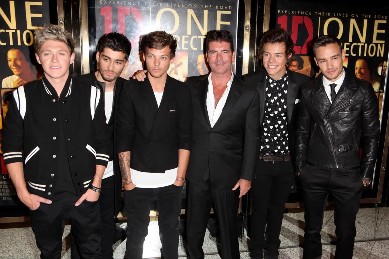 (L to R) Niall Horan, Zayn Malik, Louis Tomlinson, Simon Cowell, Harry Styles and Liam Payne attend the World Premiere of 'One Direction: This Is Us 3D' at Empire Leicester Square on August 20, 2013 in London, England. DAVE M. BENETT/WIREIMAGE