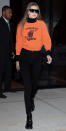 <p>The model added a pop of color to her otherwise all-black outfit with an orange sweatshirt reading "Somerset Tigers" (get your own orange pullover <a rel="nofollow noopener" href="https://click.linksynergy.com/fs-bin/click?id=93xLBvPhAeE&subid=0&offerid=390098.1&type=10&tmpid=8158&RD_PARM1=http%253A%252F%252Fshop.nordstrom.com%252Fs%252Ftopshop-boutique-balloon-sleeve-sweatshirt%252F4609452&u1=ISGigiHadidStreetStyle3.17JA" target="_blank" data-ylk="slk:here;elm:context_link;itc:0;sec:content-canvas" class="link ">here</a>). She wore it over a black turtleneck and paired with black jeans from Frame Denim ($209; <a rel="nofollow noopener" href="https://click.linksynergy.com/fs-bin/click?id=93xLBvPhAeE&subid=0&offerid=484990.1&type=10&tmpid=23604&RD_PARM1=https%253A%252F%252Fwww.shopbop.com%252Fforever-karlie-skinny-jeans-frame%252Fvp%252Fv%253D1%252F1597251282.htm%253FfolderID%253D18389%2526fm%253Dother-shopbysize-viewall%2526os%253Dfalse%2526colorId%253D10652&u1=ISGigiHadidStreetStyle3.20JA" target="_blank" data-ylk="slk:shopbop.com;elm:context_link;itc:0;sec:content-canvas" class="link ">shopbop.com</a>) and patent leather booties. </p>