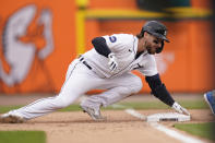 Detroit Tigers' Eric Haase overruns third base for a RBI triple during the fourth inning of a baseball game against the Toronto Blue Jays, Saturday, June 11, 2022, in Detroit. (AP Photo/Carlos Osorio)