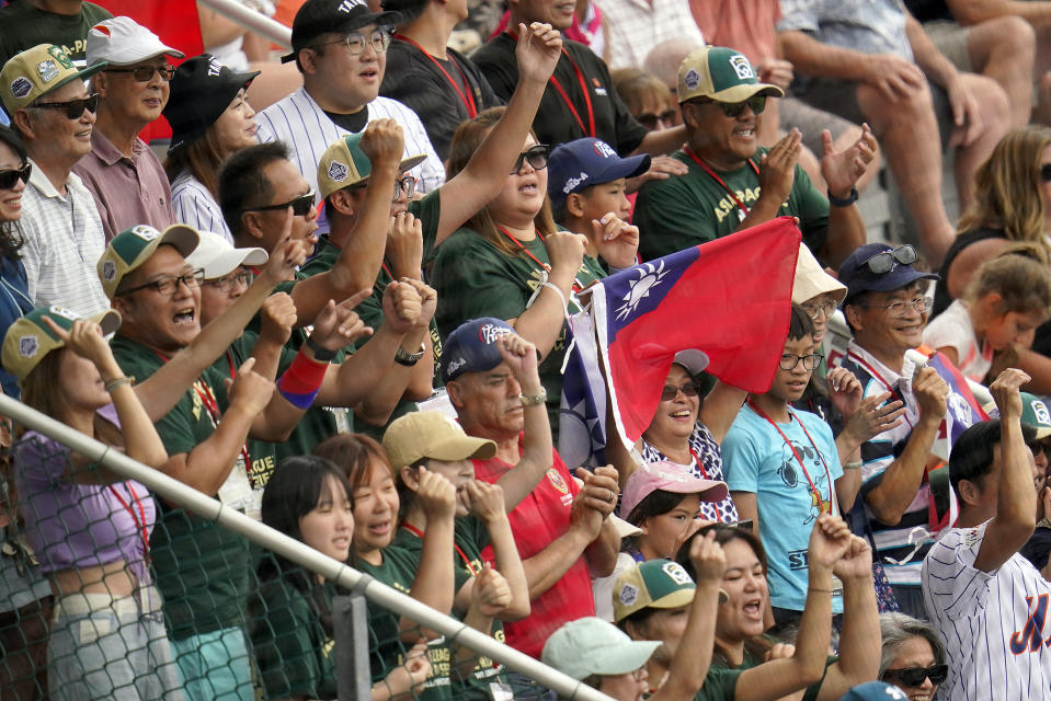 Taiwan fans cheer in the grandstands during the fourth inning of a baseball game against Curacao at the Little League World Series in South Williamsport, Pa., Wednesday, Aug. 23, 2023. (AP Photo/Tom E. Puskar)