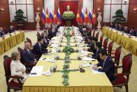 Russian President Vladimir Putin, seventh left, and General Secretary of the Communist Party of Vietnam Central Committee Nguyen Phu Trong, seventh right, attend the talks at the Communist Party Central Committee headquarters, in Hanoi, Thursday, June 20, 2024. (Gavriil Grigorov, Sputnik, Kremlin Pool Photo via AP)