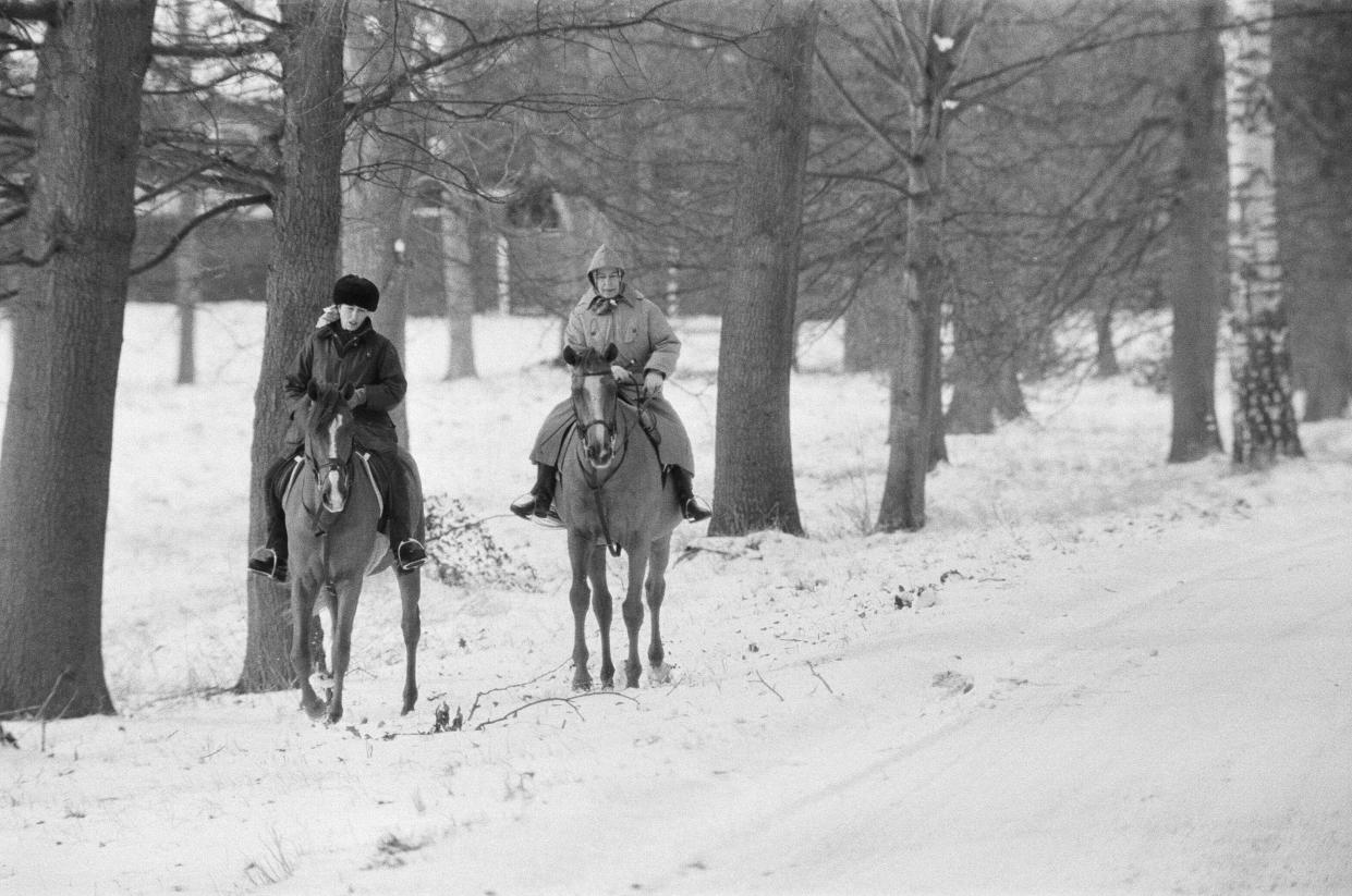 The Royal Family at Christmas and New Year. Queen Elizabeth II and Princess Anne, out riding their horses in the snow, during their New Year holiday at Sandringham, Norfolk. Picture taken 2nd January 1979. (Photo by Pete Case/Mirrorpix/Getty Images)