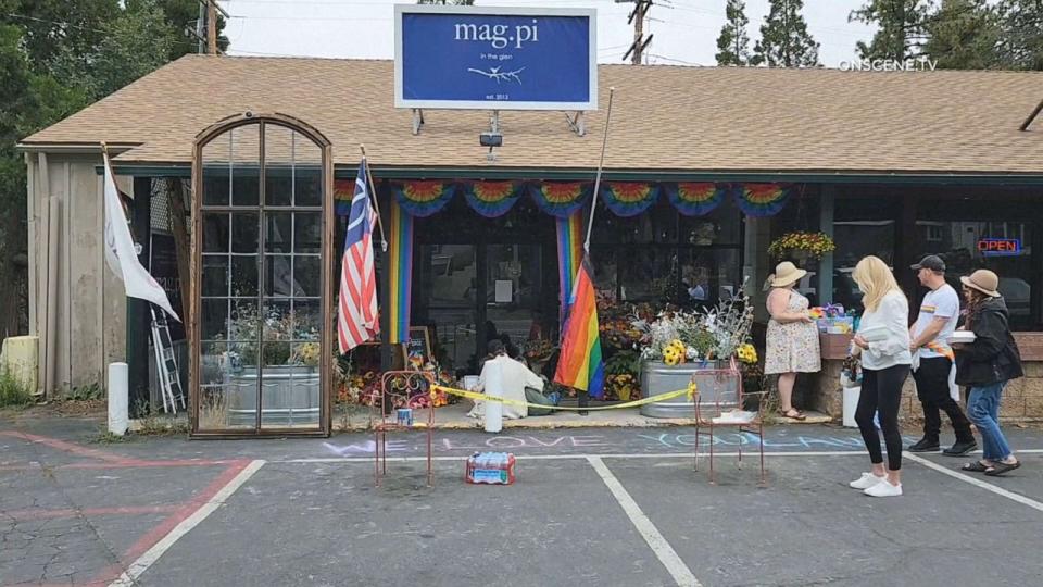 PHOTO: People visit the store in Lake Arrowhead, Calif., where a store owner was shot and killed following a confrontation over a Pride flag on Aug. 18, 2023. (OnScene.TV)