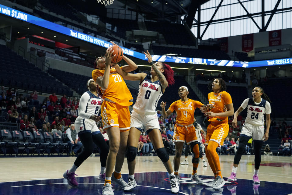 Tennessee center Tamari Key (20) snags a rebound from Mississippi forward Shakira Austin (0) during the second half of an NCAA college basketball game in Oxford, Miss., Sunday, Jan. 9, 2022. (AP Photo/Rogelio V. Solis)