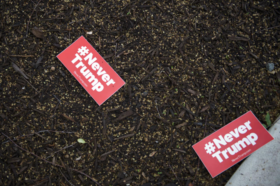 Anti-Trump bumper stickers on the ground outside the Republican National Committee (RNC) building in Washington, DC, USA, 12 May 2016. US Republican presidential candidate Trump is meeting this morning with Speaker of the House Paul Ryan in an attempt to iron out their differences and solidify their support for one another.  (Shawn Thew/EPA)