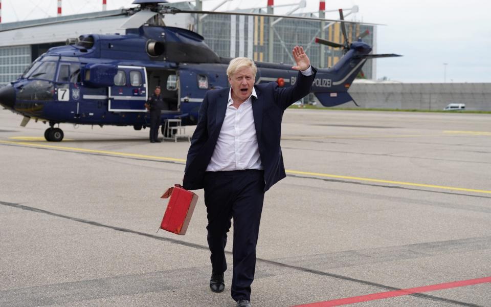 Boris Johnson is pictured at Munich Airport after leaving the G7 summit in southern Germany - Stefan Rousseau/PA