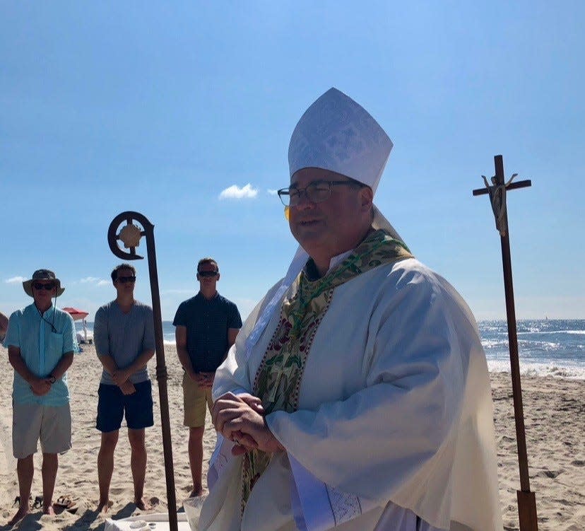 Bishop Richard Henning speaks at a Blessing of the Waters service on Long Island during his tenure as bishop of the Diocese of Rockville Center in New York.