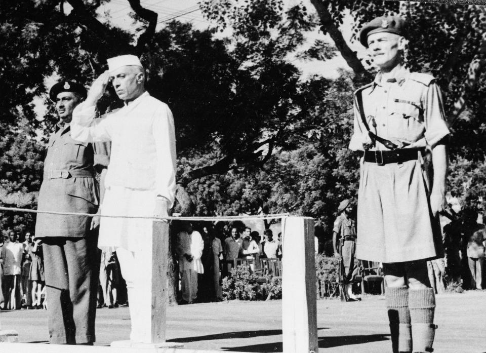 FILE - Jawaharlal Nehru salutes the flag as he becomes independent India's first prime minister on Aug. 15, 1947 during the Independence Day ceremony at Red Fort, New Delhi, India. “At the stroke of the midnight hour, when the world sleeps, India will awake to life and freedom," Nehru famously spoke, words that were heard over live radio by millions of Indians. Then he promised: “To the nations and peoples of the world, we send greetings and pledge ourselves to cooperate with them in furthering peace, freedom and democracy.” (AP Photo/File)