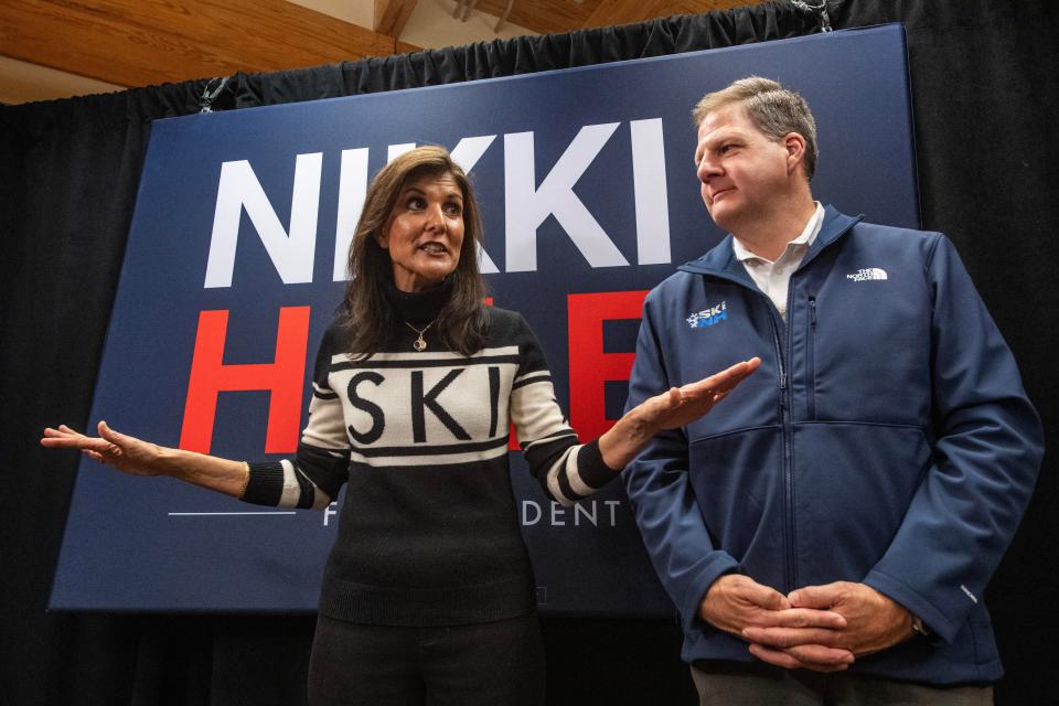 Former UN ambassador and 2024 Republican presidential hopeful Nikki Haley speaks to the press with New Hampshire Gov. Chris Sununu at a town hall campaign event at Kennett High School in North Conway, New Hampshire, on Dec. 28, 2023.