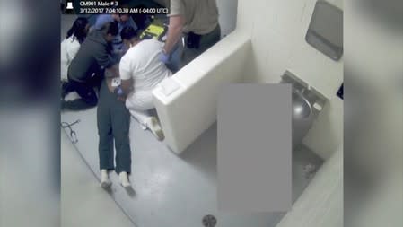 Prison nurses perform CPR on Demilio Glover at the Chatham County Detention Center in Savannah