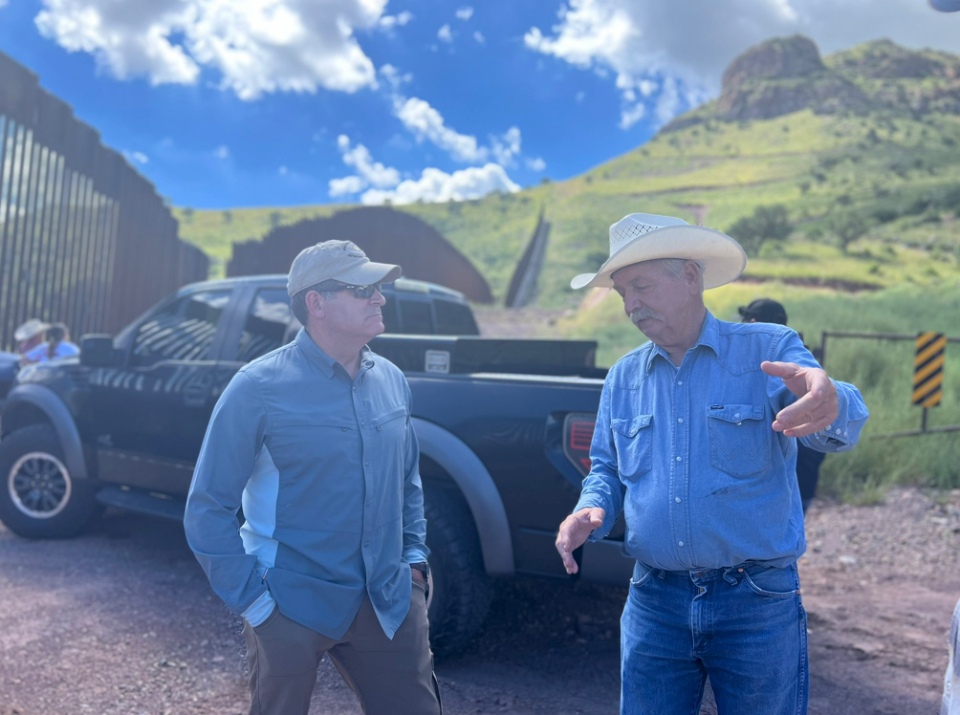 U.S. Rep. Mark Green of Clarksville speaks with John Ladd, an Arizona rancher, who was telling Green about the migrants coming across the U.S.-Mexico border who died from the elements while making the dangerous trek.
