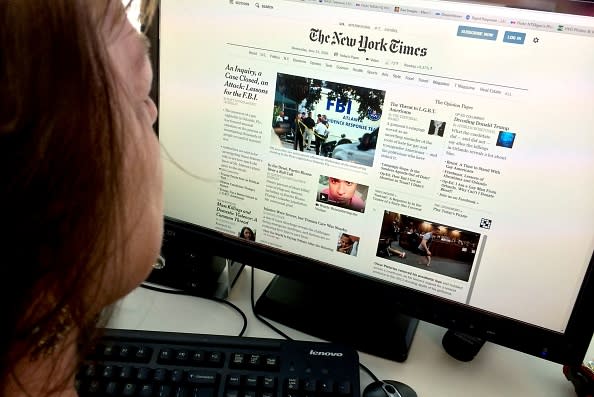 The New York Times said that its digital subscriptions are now bringing in more revenue than online ads. (Photo credit: KAREN BLEIER/AFP/Getty Images)