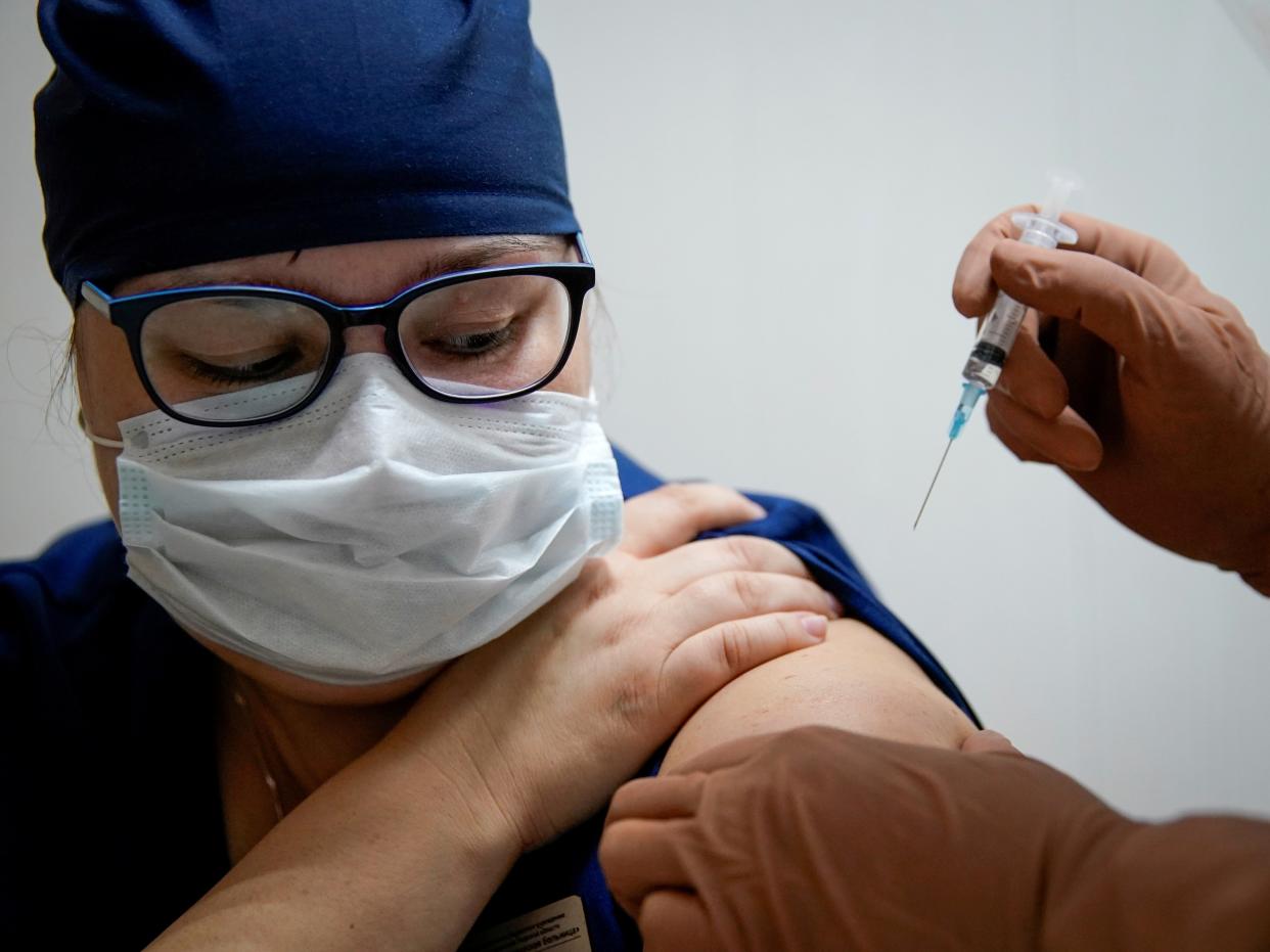 A medic received Russia’s ‘Sputnik V’ Covid-19 vaccine (Tatyana Makeyeva/Reuters)