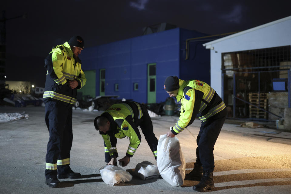 Rescuers from Bosnia's mountain rescue services prepare food packages prior to their departure from Sarajevo, Bosnia, Tuesday, Feb. 7, 2023. Team of 25 men and women left from Sarajevo to Turkey after devastating earthquake with more than 6000 casualties. (AP Photo/Armin Durgut)