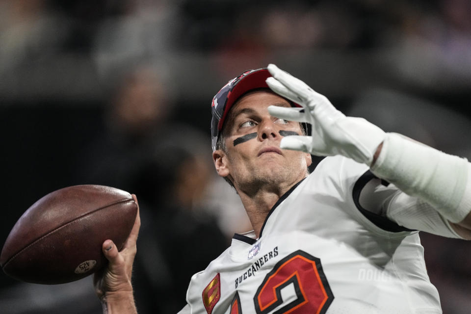 Tampa Bay Buccaneers quarterback Tom Brady (12) warms up before an NFL football game against the Atlanta Falcons, Sunday, Jan. 8, 2023, in Atlanta. (AP Photo/John Bazemore)