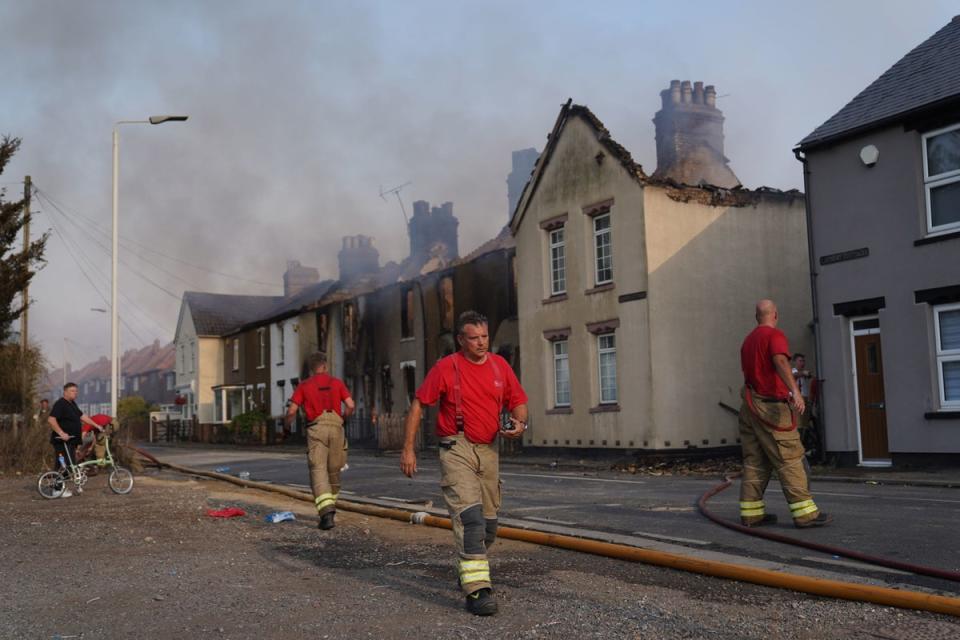 Firefighters at the scene of a blaze in the village of Wennington, east London. (PA)