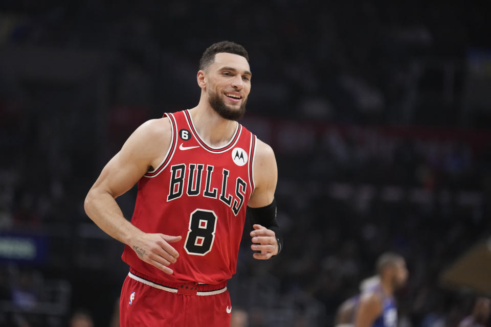 Chicago Bulls guard Zach LaVine smiles after scoring against the Los Angeles Clippers during the first half of an NBA basketball game Monday, March 27, 2023, in Los Angeles. (AP Photo/Marcio Jose Sanchez)
