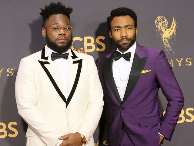 <p>David Livingston/Getty </p> Steven Glover and Donald Glover at the 69th Annual Primetime Emmy Awards in 2017