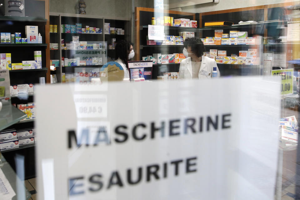 FILE - In this Feb. 22, 2020, file photo, a note reading in Italian "Masks sold out" hangs on the window of a pharmacy in Codogno, near Lodi, Northern Italy. Fear of the spreading coronavirus has led to a global run on sales of face masks despite medical experts' advice that most people who aren't sick don't need to wear them. (AP Photo/Luca Bruno, File)