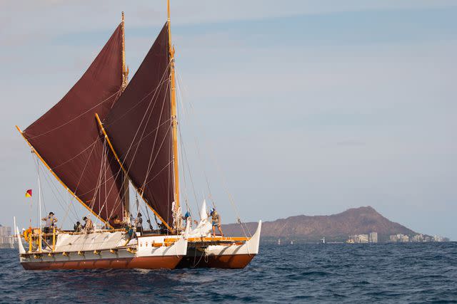 <p>Kaipu Ki'aha/Ōiwi TV/Courtesy of Polynesian Voyaging Society</p> Polynesian Voyaging Society members under sail off Lē'ahi, or Diamond Head.