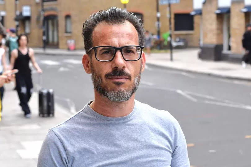 Mauro Delicato pictured in a street wearing a grey t-shirt