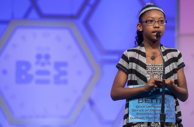 Bettie Closs of North Carolina, spells her word, "osteomalacia," during the 3rd round of the 88th Annual Scripps National Spelling Bee at National Harbor, Maryland, May 27, 2015