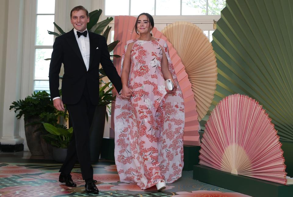 Naomi Biden (R) and her husband Peter Neal arrive at the White House for a state dinner on April 10, 2024 in Washington, DC. U.S. President Joe Biden and first lady Jill Biden are hosting a state dinner for Japanese Prime Minister Fumio Kishida as part of his official state visit