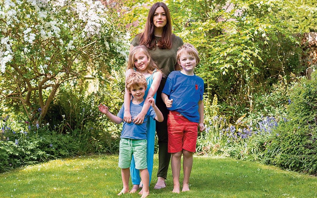 'I was mis-sold my 40s,' says White, pictured with her twins, Agatha and Benny, and younger son Alex - Suzannah Ginders