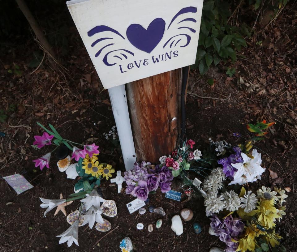 A memorial to Madison Sparrow stands in front of Maclary Elementary School nearly two years after she was murdered in a wooded park adjacent to the school.