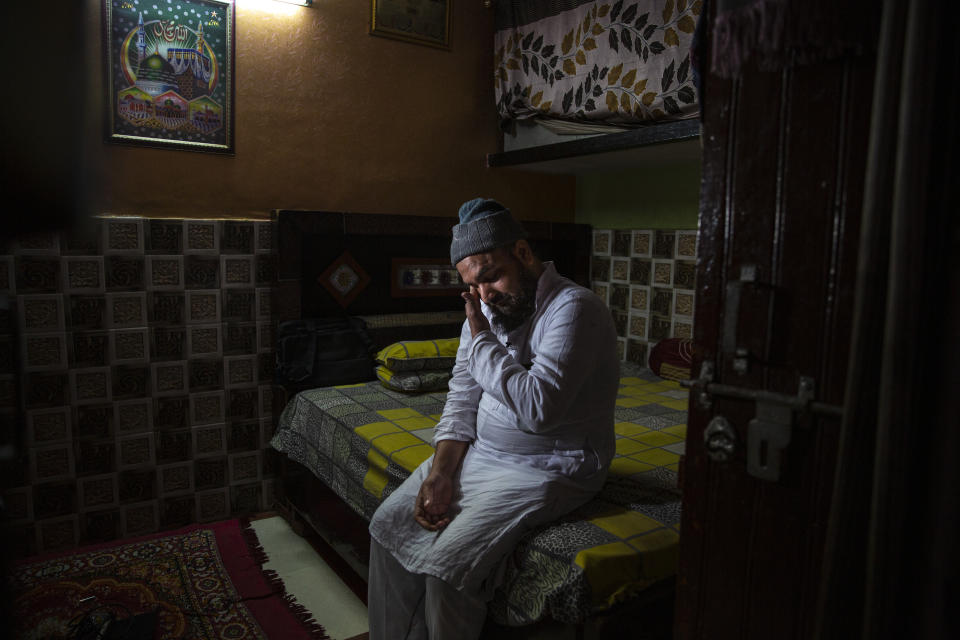 Haroon, who saw his 32 year-old brother being shot and killed by his Hindu neighbors during the February 2020 communal riots, breaks down while speaking to Associated Press inside his home in North Ghonda, one of the worst riot affected neighborhood, in New Delhi, India, Friday, Feb. 19, 2021. As the first anniversary of bloody communal riots that convulsed the Indian capital approaches, Muslim victims are still shaken and struggling to make sense of their struggle to seek justice. (AP Photo/Altaf Qadri)