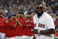 Former Boston Red Sox's David Ortiz comes onto the field to throw out a ceremonial first pitch before a baseball game against the New York Yankees in Boston, Monday, Sept. 9, 2019. (AP Photo/Michael Dwyer)