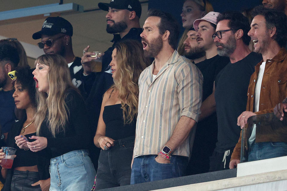 EAST RUTHERFORD, NEW JERSEY – OCTOBER 01: (L-R) Singer Taylor Swift, Actor Ryan Reynolds and Actor Hugh Jackman cheer prior to the game between the Kansas City Chiefs and the New York Jets at MetLife Stadium on October 01, 2023 in East Rutherford, New Jersey. (Photo by Elsa/Getty Images)
