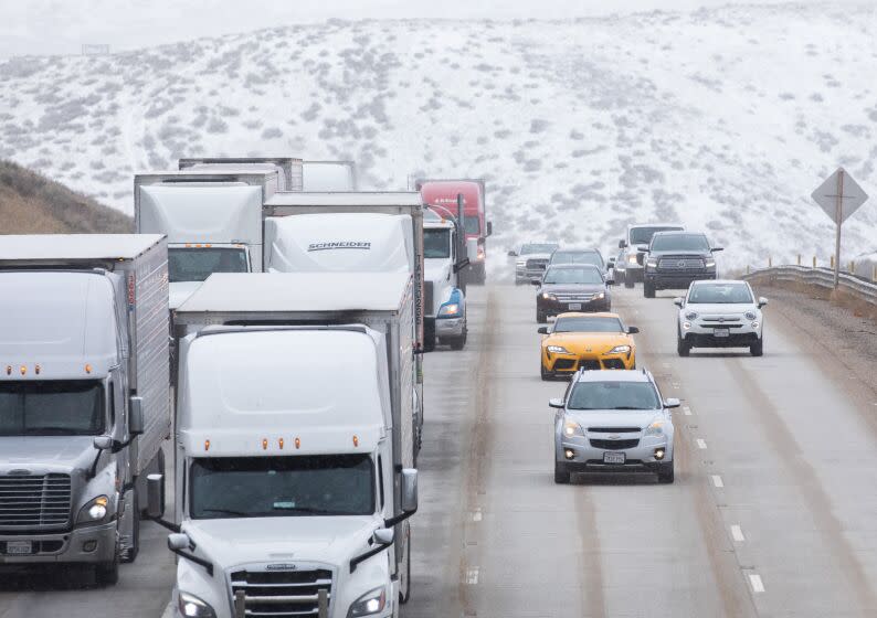 GORMAN, CA - JANUARY 30: Traffic on the 5 Freeway drives through a snowy landscape in Gorman on Monday, Jan. 30, 2023 in Gorman, CA. (Myung J. Chun / Los Angeles Times)