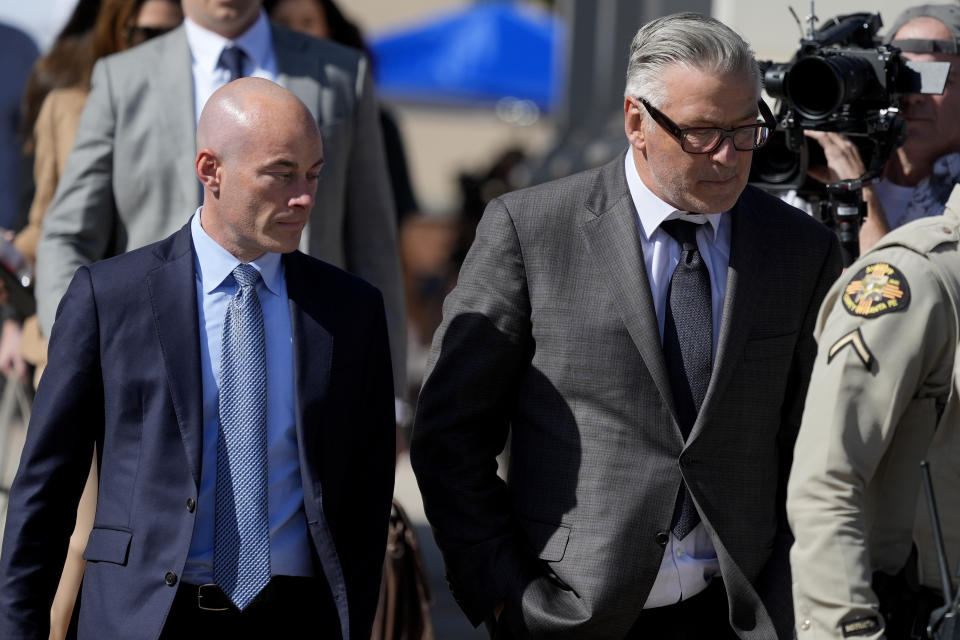 Actor Alec Baldwin, right, and attorney Luke Nikas, leave court after jury selection in Baldwin's involuntary manslaughter trial, Tuesday, July 9, 2024, in Santa Fe, N.M. (AP Photo/Ross D. Franklin)