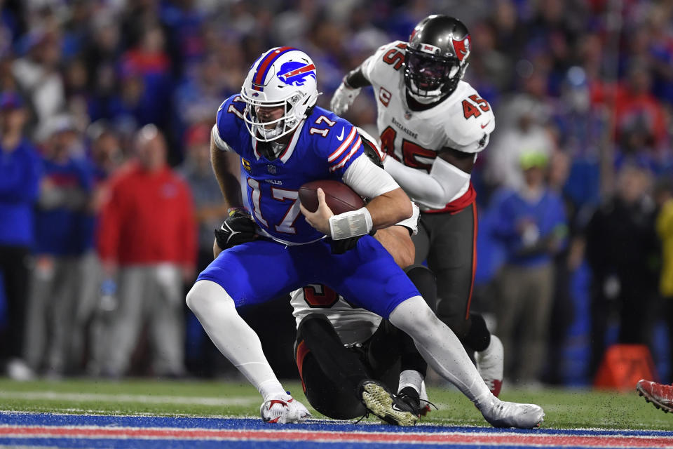 Buffalo Bills quarterback Josh Allen (17) is sacked by Tampa Bay Buccaneers linebacker Anthony Nelson, middle, in the second half of an NFL football game, Thursday, Oct. 26, 2023, in Orchard Park, N.Y. Tampa Bay linebacker Devin White is at rear. (AP Photo/Adrian Kraus)