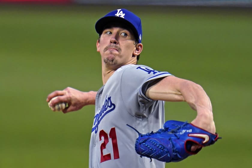 Los Angeles Dodgers starting pitcher Walker Buehler winds up during the third inning of the team's baseball game against the Pittsburgh Pirates in Pittsburgh, Tuesday, June 8, 2021. (AP Photo/Gene J. Puskar)
