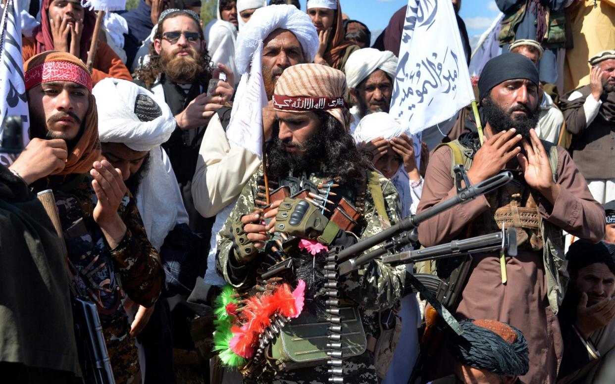 Afghan Taliban militants and villagers attend a gathering as they celebrate the peace deal and their victory in the Afghan conflict on US in Afghanistan, in Alingar district of Laghman Province on March 2, 2020. - The Taliban said on March 2 they were resuming offensive operations against Afghan security forces, ending the partial truce that preceded the signing of a deal between the insurgents and Washington. (Photo by NOORULLAH SHIRZADA / AFP) (Photo by NOORULLAH SHIRZADA/AFP via Getty Images) - NOORULLAH SHIRZADA/AFP via Getty Images