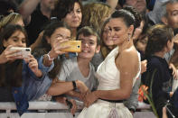 Actress Penelope Cruz poses for photographs with fans upon arrival for the premiere of the film 'Wasp Network' at the 67th San Sebastian Film Festival, in San Sebastian, northern Spain Friday, Sept. 27, 2019. (AP Photo/Alvaro Barrientos)