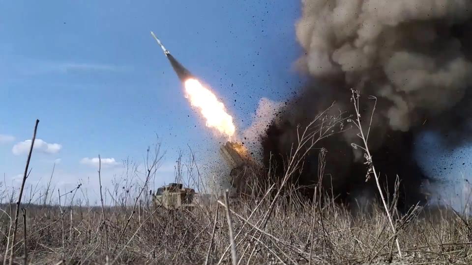 In this photo taken from video released by Russian Defense Ministry Press Service on Saturday, March 30, 2024, a rocket is fired from the Russian army's missile system toward Ukrainian position at an undisclosed location. (Russian Defense Ministry Press Service photo via AP)