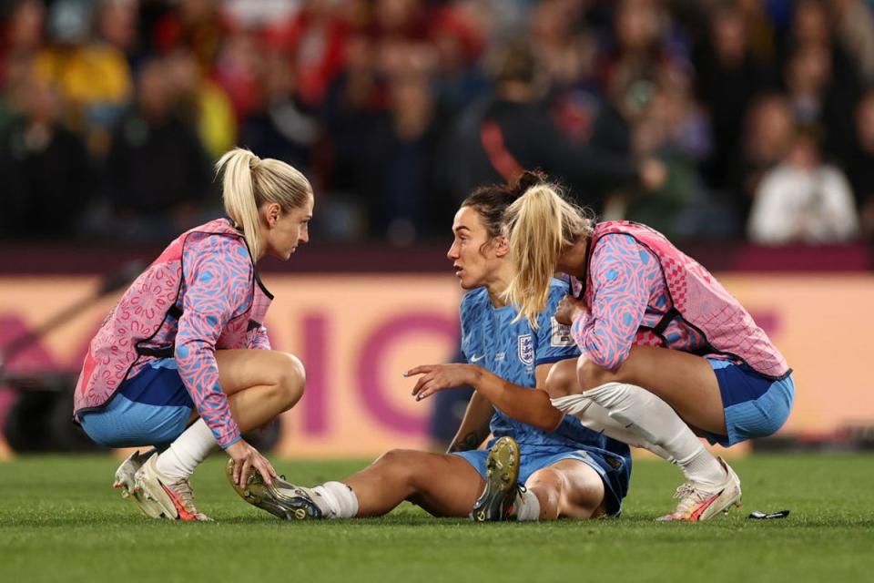 Lucy Bronze is consolled after the World Cup slipped away (The FA via Getty Images)