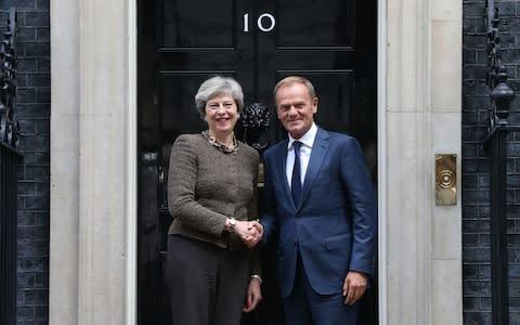 Prime Minister Theresa May greets President of the European Council Donald Tusk  - Credit: Jonathan Brady/PA