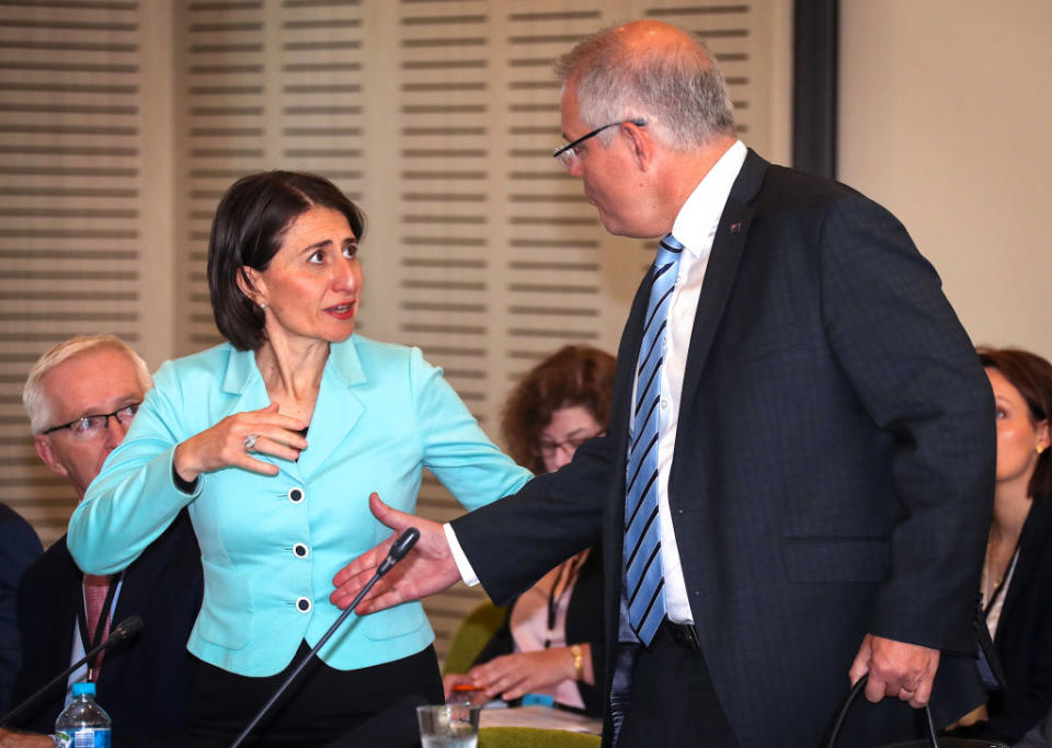 The Premier of New South Wales Gladys Berejiklian reacts as Australian Prime Minister Scott Morrison goes to shake her hand as he arrives at the Meeting of the Council of Australian Governments (COAG) at Parramatta Stadium.