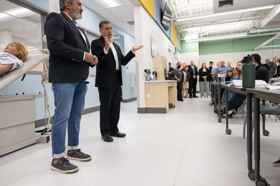 U.S. Department of Health and Human Services Secretary Xavier Becerra, center, talks with students from Rio Americano High School with Congressman Ami Bera, left, during a visit to the Sacramento region on Monday to highlight his department’s efforts to expand the health care workforce.