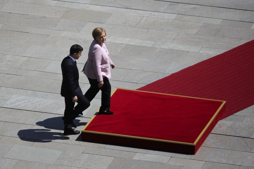 German Chancellor Angela Merkel, right, welcomes Ukrainian President Volodymyr Zelenskiy, left, for a meeting at the chancellery in Berlin, Germany, Tuesday, June 18, 2019. (AP Photo/Markus Schreiber)